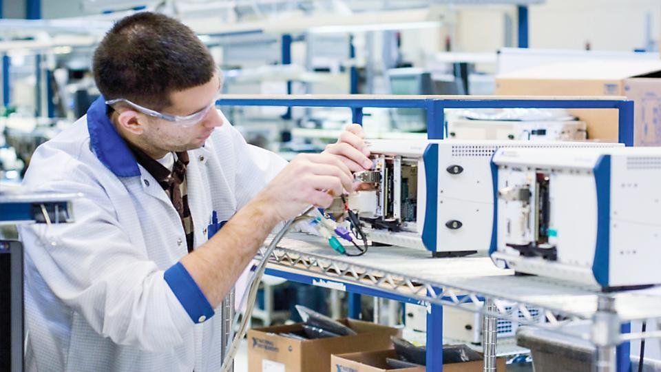 Technician calibrating instruments in a laboratory